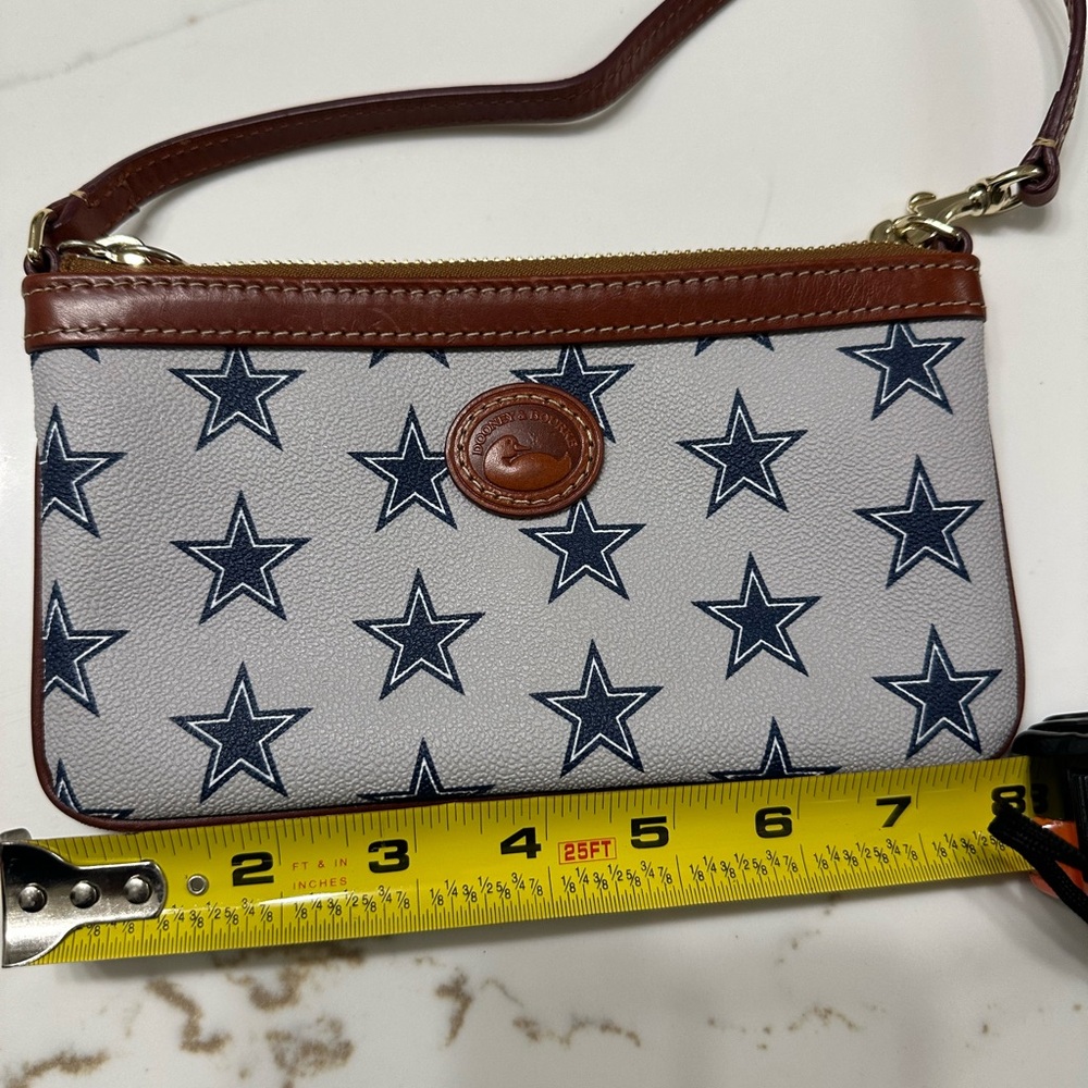 Dooney & Bourke Blue Star Pattern Wristlet with Brown Trim